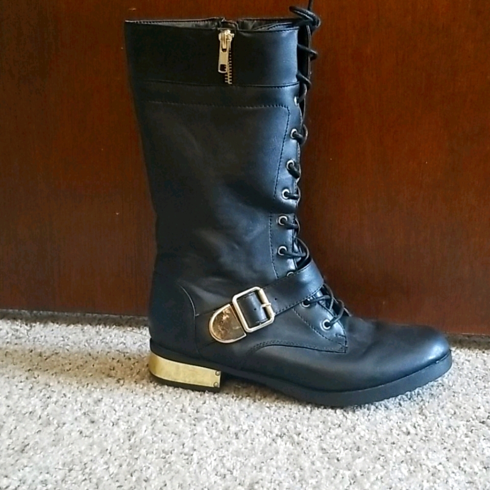 Black lace up boots with gold accents